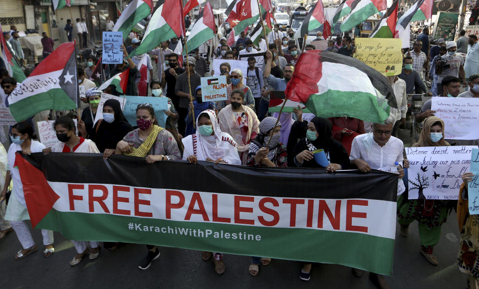 People take part in a rally in support of Palestinians, in Karachi, Pakistan, Thursday, May 20, 2021. (AP Photo/Fareed Khan)