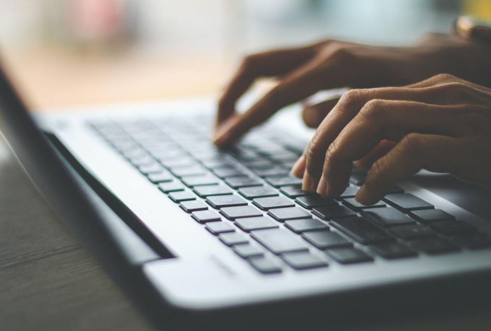 Person typing on a laptop