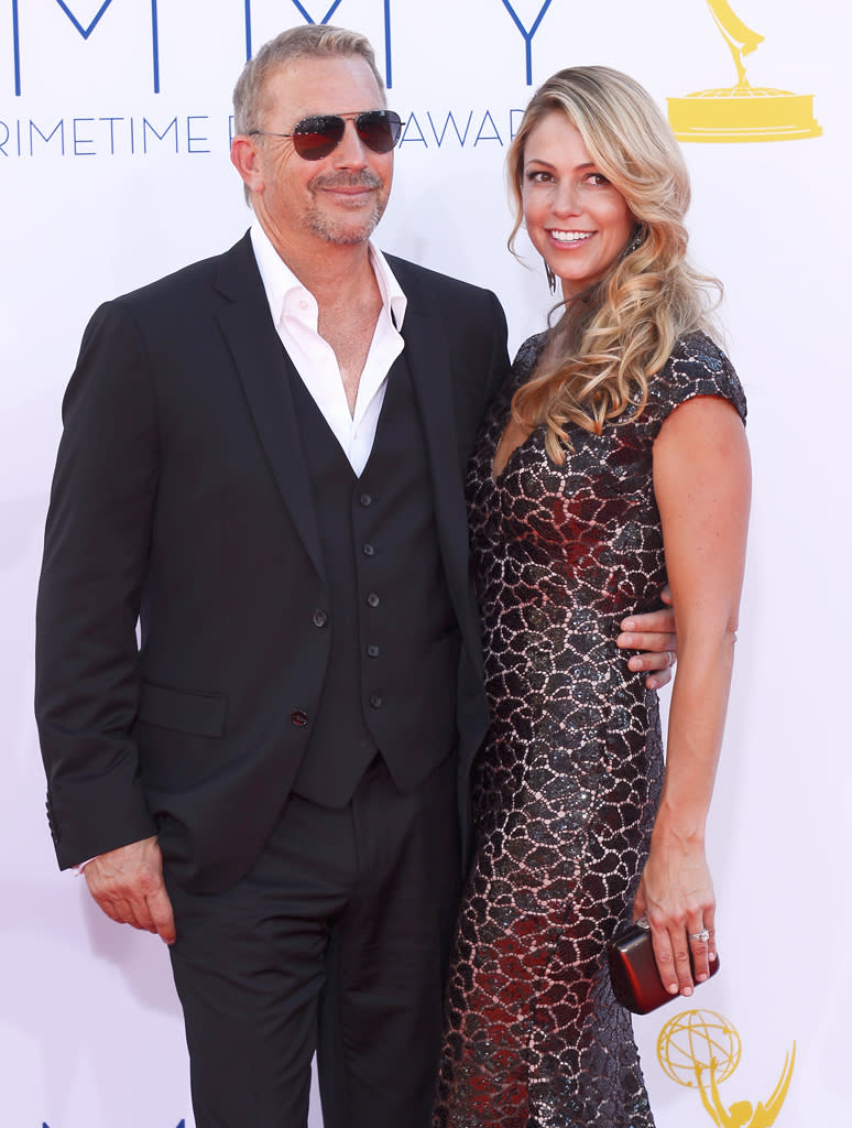 Kevin Costner and wife Christine Baumgartner arrive at the 64th Primetime Emmy Awards at the Nokia Theatre in Los Angeles on September 23, 2012.