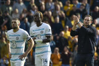 Chelsea's caretaker manager Frank Lampard, right, applauds at the end of the English Premier League soccer match between Wolverhampton Wanderers and Chelsea, at the Molineux Stadium, in Wolverhampton, England, Saturday, April 8, 2023. (AP Photo/Rui Vieira)