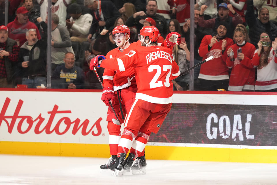 Detroit Red Wings center Andrew Copp is greeted by center Michael Rasmussen (27) after Copp's goal during the second period of an NHL hockey game against the Philadelphia Flyers, Thursday, Jan. 25, 2024, in Detroit. (AP Photo/Carlos Osorio)