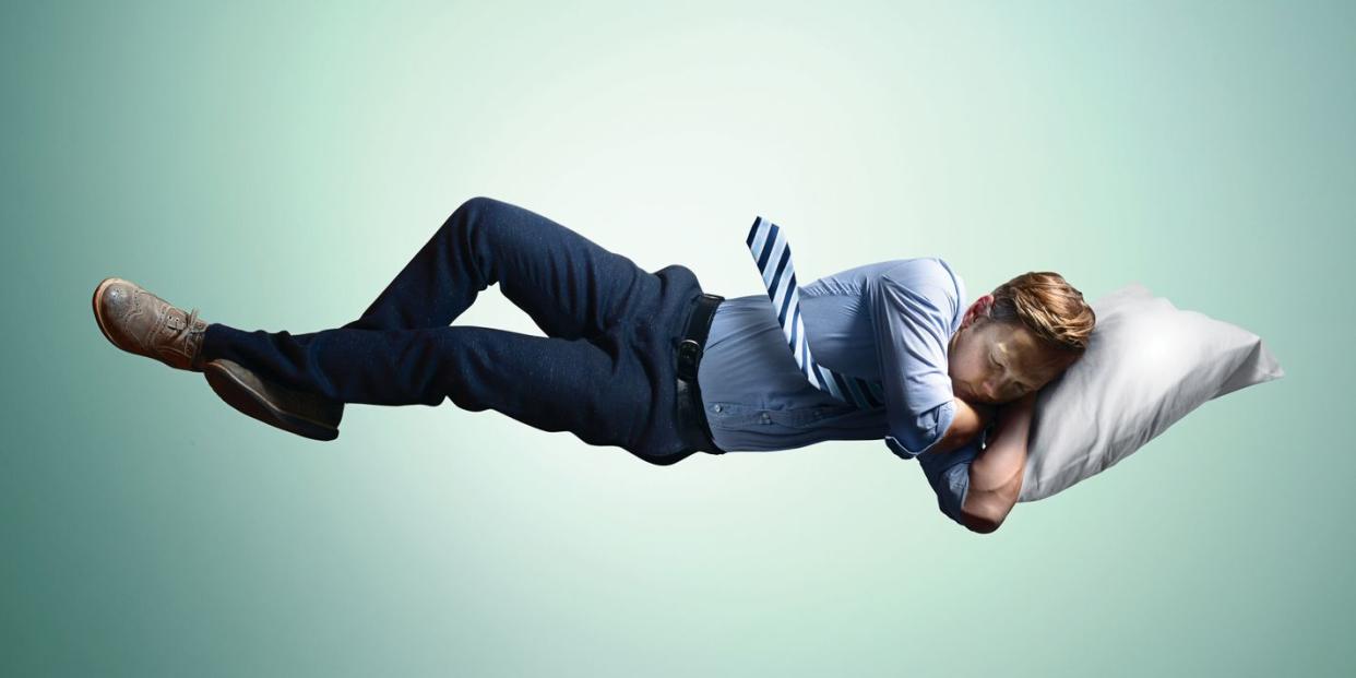 man floating in mid air, sleeping