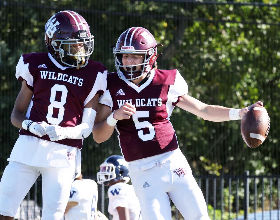 West Bridgewater quarterback James Harris, right, scores a touchdown and is congratulated by Jayden Cobbs during a game versus Nantucket on Saturday, Sept. 24, 2022.  