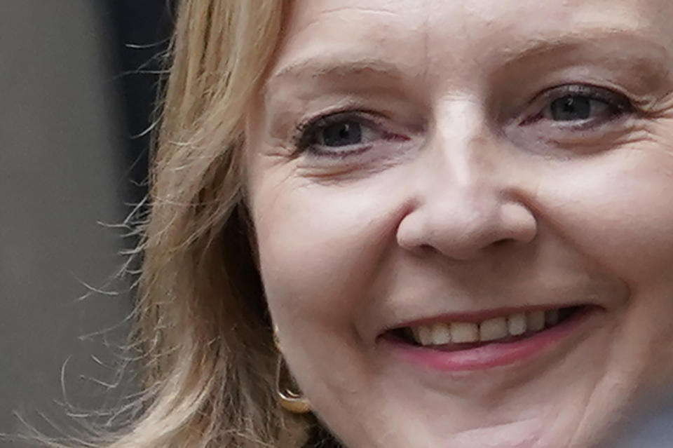 Liz Truss smiles as she leaves the Conservative Central Office in Westminster after winning the Conservative Party leadership contest in London, Monday, Sept. 5, 2022. Liz Truss will become Britain's new Prime Minister after an audience with Britain's Queen Elizabeth II on Tuesday Sept. 6. (AP Photo/Alberto Pezzali)