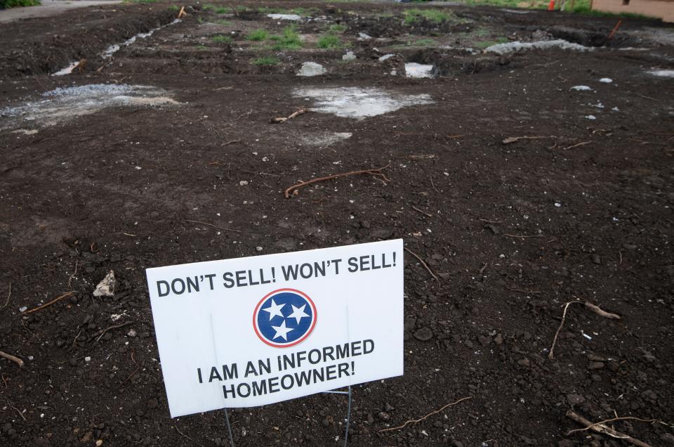 A sign rests in the yard at Sam Brown’s homesite Wednesday, July 22, 2020 in Nashville, Tenn.