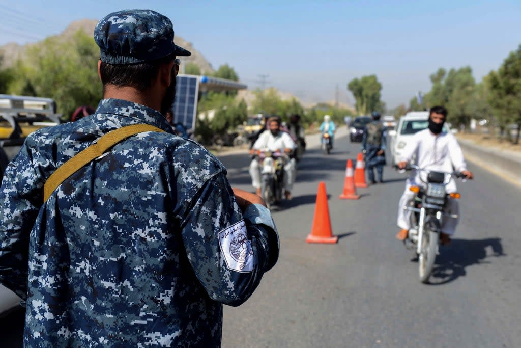 A Taliban fighter is shown at a checkpoint in Kandahar on 21 September, 2021.  (AFP via Getty Images)