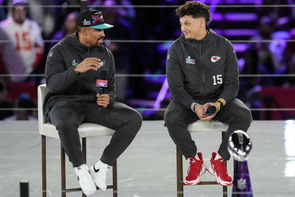 Kansas City Chiefs quarterback Patrick Mahomes, right, and Philadelphia Eagles quarterback Jalen Hurts speak to the media during the NFL football Super Bowl 57 opening night, Monday, Feb. 6, 2023, in Phoenix. The Kansas City Chiefs will play the Philadelphia Eagles on Sunday. (AP Photo/Ross D. Franklin)