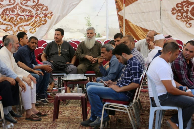 Relatives of 17-year-old Mohammed Jawawdeh, who was shot dead by an Israeli security guard after he attacked him with a screwdriver at the Israeli embassy compound, gather in a mourning tent in the capital Amman on July 24, 2017