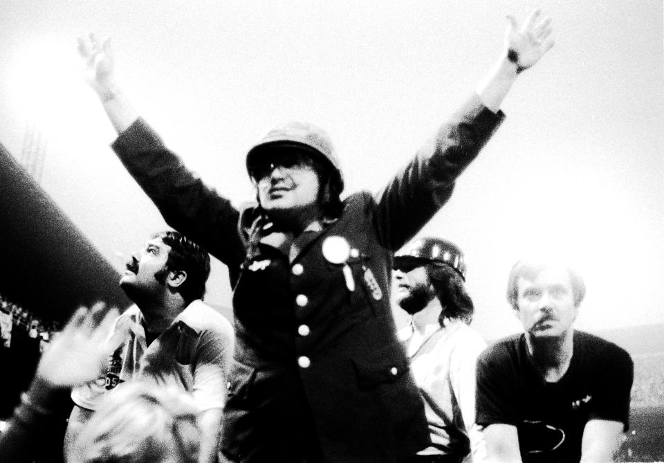 Chicago DJ Steve Dahl leads the crowd in anti-disco chants during the Disco Demolition Night, held at Comiskey Park, in between games of a doubleheader between the Chicago White Sox and the Detroit Tigers, Chicago, Illinois, July 12, 1979. (Photo: Paul Natkin/Getty Images)