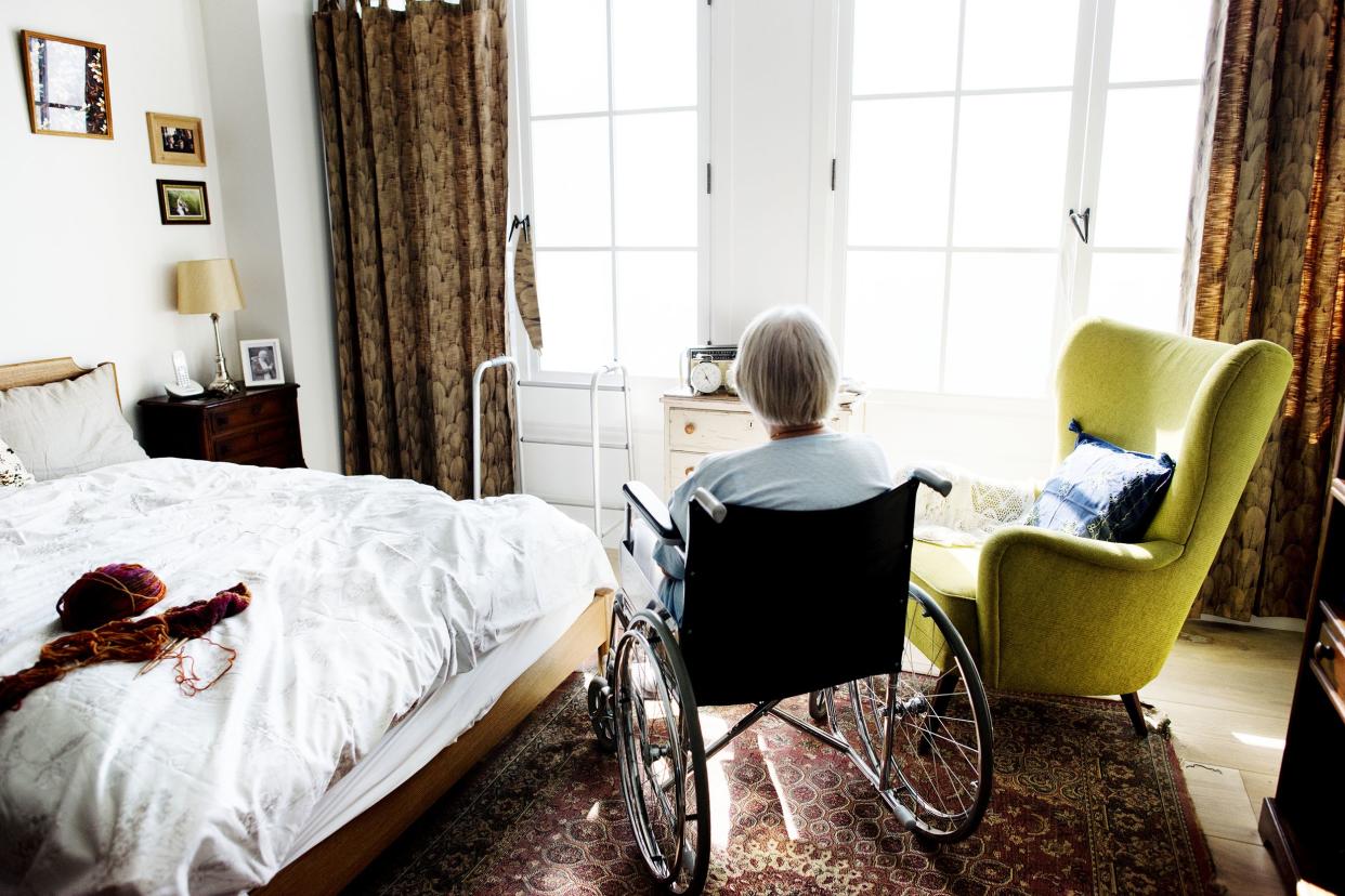 senior woman sitting on the wheelchair alone