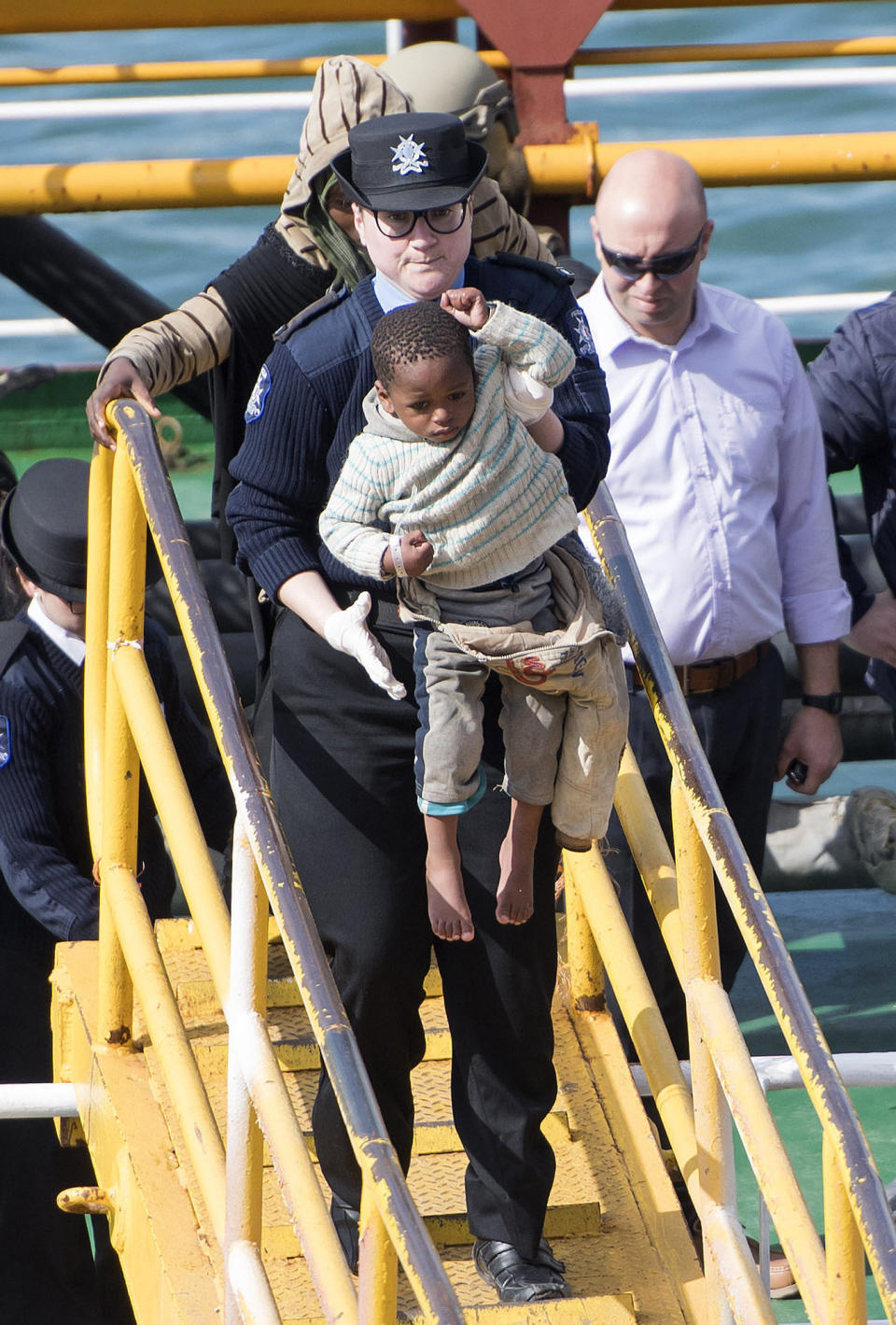 Migrants are disembarked from Turkish oil tanker El Hiblu 1, which was hijacked by migrants, in Valletta, Malta, Thursday March 28, 2019. A Maltese special operations team on Thursday boarded a tanker that had been hijacked by migrants rescued at sea, and returned control to the captain, before escorting it to a Maltese port. (AP Photo/Rene' Rossignaud)