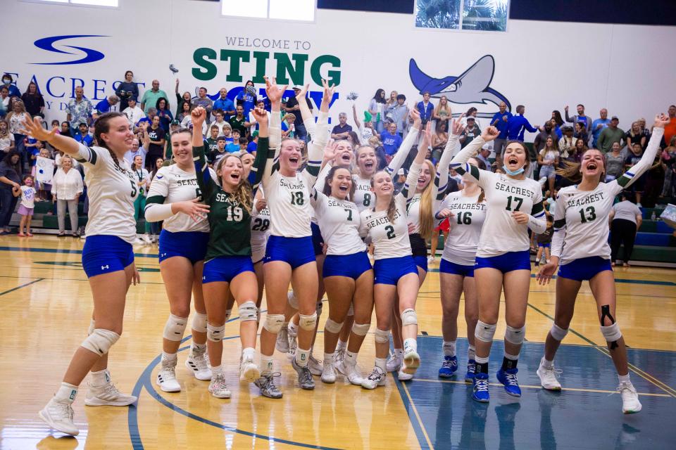 The Seacrest Country Day School volleyball team celebrates their win in the Bradenton Christian and Seacrest Country Day School volleyball 2A regional final on Saturday, Nov. 6, 2021 at Seacrest Country Day School in Naples, Fla. 