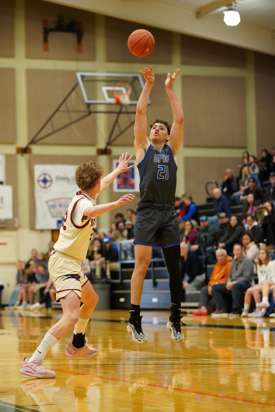 U-Prep’s  Khamron Quincy Price (20) goes up for a jump shot against Colusa’s Seth Kalisuch (22) in the first quarter of the Division IV boys basketball championship game on Saturday, Feb. 25, 2023.