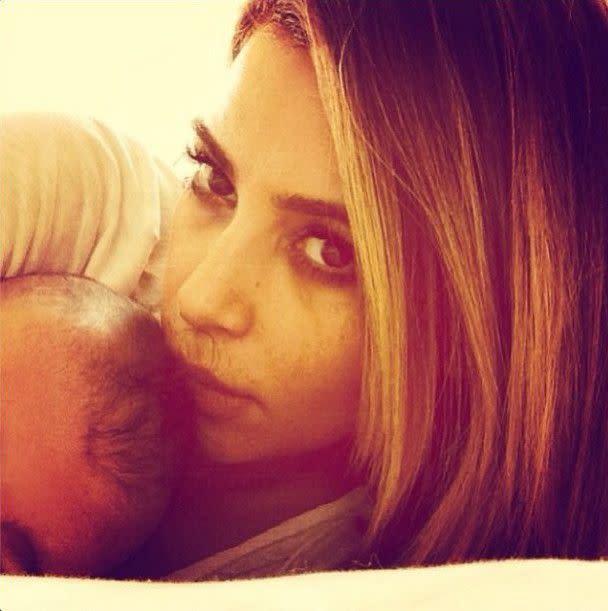 Kim Kardashian posed with daughter North West -- or at least North's forehead -- in an Instagram photo she posted on Jan. 29, 2014. "Good morning," Kim wrote, sharing a snapshot of herself snuggling with her adorable 7-month-old.