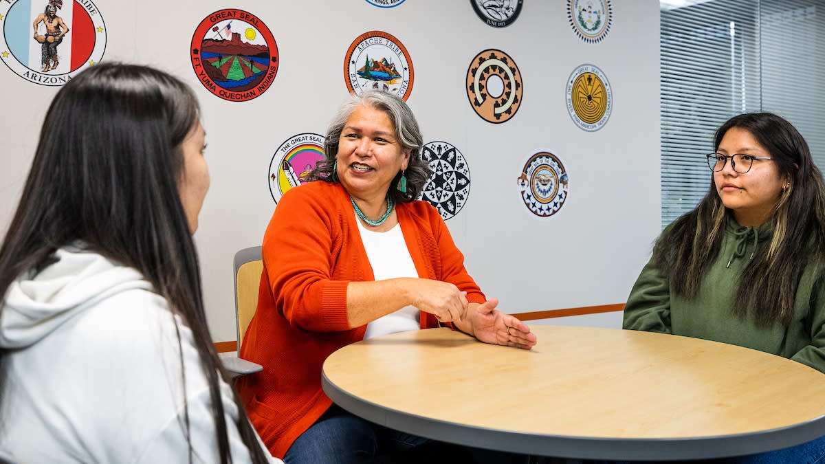 Elder-in-residence Janelle Allen of the Diné Nation (center) talks with third-year kinesiology student Nizhoni James (left) of the Navajo Nation and first-year clinical exercise science student Madison Billy, a Hopi/Navajo member, on Feb. 13 in the American Indian Student Support Services office on ASU's Downtown Phoenix campus. (Photo/Charlie Leight/ASU News)