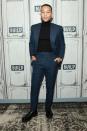 <p>If you're without a navy two-piece, you're not listening hard enough. But if you needed more proof of its versatility, look to John Legend's example, with a roll-neck and a fancy Swiss watch. You've no excuse. </p>