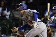 Los Angeles Dodgers' Will Smith watches after hitting a sacrifice fly to Chicago Cubs center fielder Jake Marisnick during the sixth inning of a baseball game in Chicago, Wednesday, May 5, 2021. (AP Photo/Nam Y. Huh)