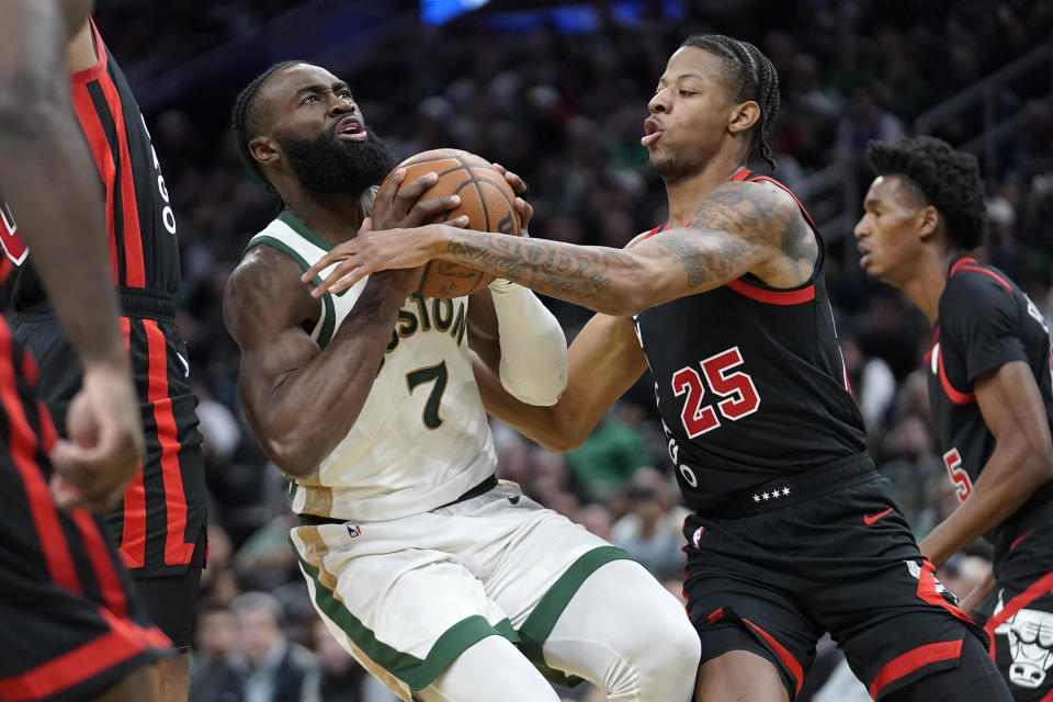 Boston Celtics guard Jaylen Brown (7) takes a shot at the basket as Chicago Bulls forward Dalen Terry (25) defends in the second half of an NBA In-Season Tournament basketball game, Tuesday, Nov. 28, 2023, in Boston. (AP Photo/Steven Senne)