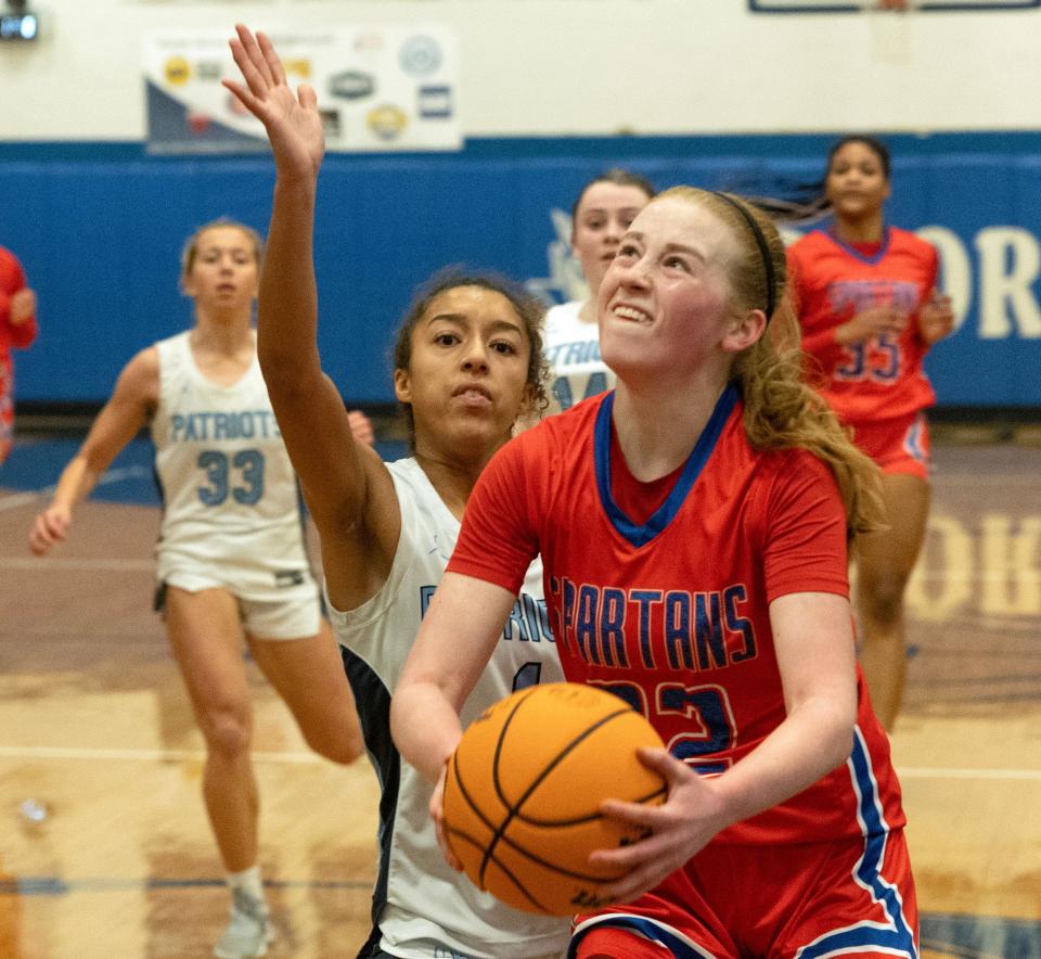 Ocean Eli Clark drives to the basket in first half action. Ocean Twp. Girls Basketball defeats Freehold Township in Blue Devil Holiday Invitational in West Long Branch on December 28, 2023.