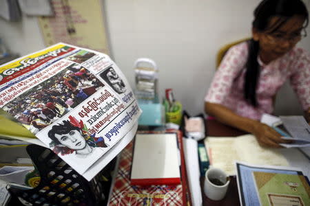 A copy of Aung Zay Yathu, a weekly promoting nationalism published by Ma Ba Tha, is seen at the head office of the Buddhist group, in Yangon August 26, 2015. The headline on the paper reads, "Criticising Daw Suu (Aung San Suu Kyi) and the National League for Democracy (NLD) who have been crowing they will change the systems". REUTERS/Soe Zeya Tun