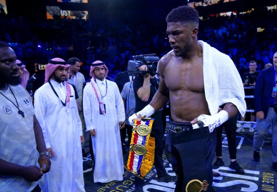 Anthony Joshua briefly walked off with the belts (PA Wire)