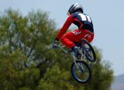 U.S. Olympic athlete Connor Fields goes off a jump as he works out on his BMX bike at the Olympic Training Center in Chula Vista, California, United States, July 1, 2016. REUTERS/Mike Blake