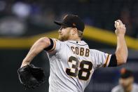 San Francisco Giants starting pitcher Alex Cobb throws to an Arizona Diamondbacks batter during the first inning of a baseball game Wednesday, July 6, 2022, in Phoenix. (AP Photo/Ross D. Franklin)