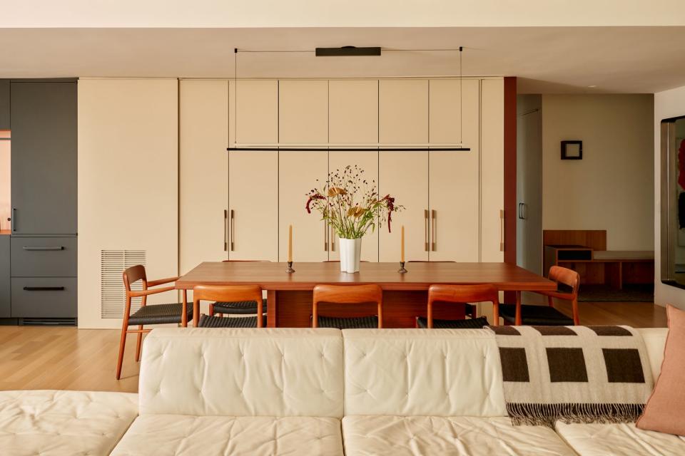 sleek white sofa near dining table