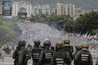 <p>Bolivarian National Guards stand on a highway overlooking an anti-government march trying to make its way to the National Assembly in Caracas, Venezuela, Wednesday, May 3, 2017. (AP Photo/Fernando Llano) </p>