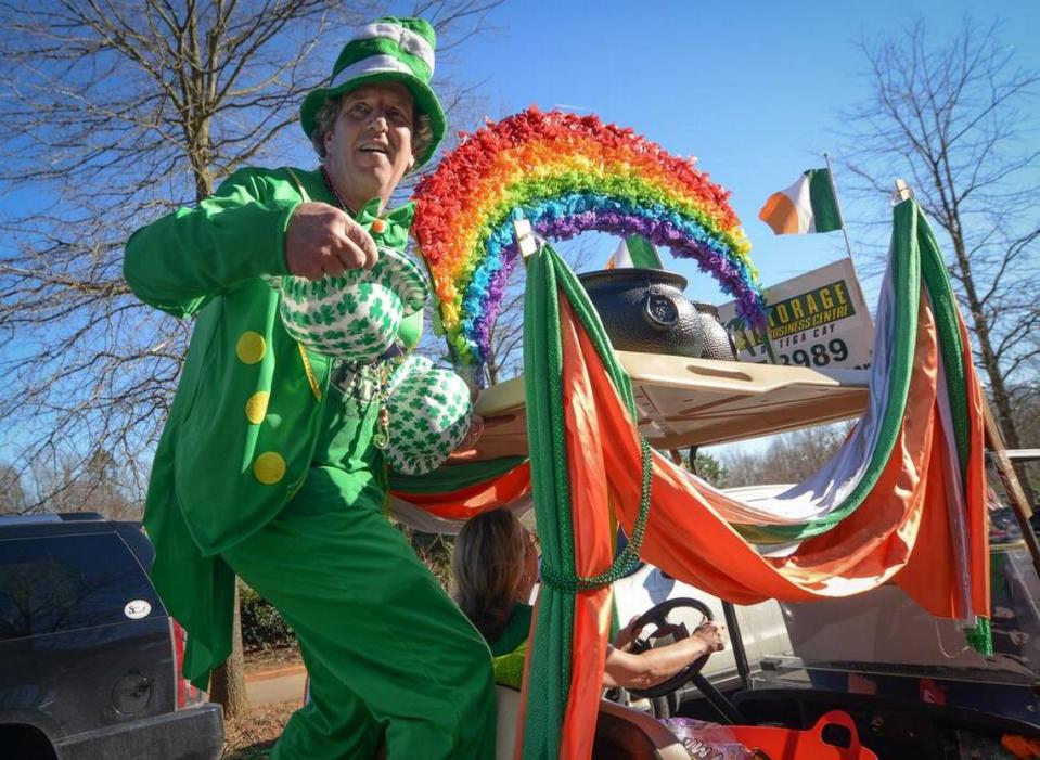 Sam Lawrence prepares to toss a hat at a Baxter Village St. Patrick’s Day parade in Fort Mill.