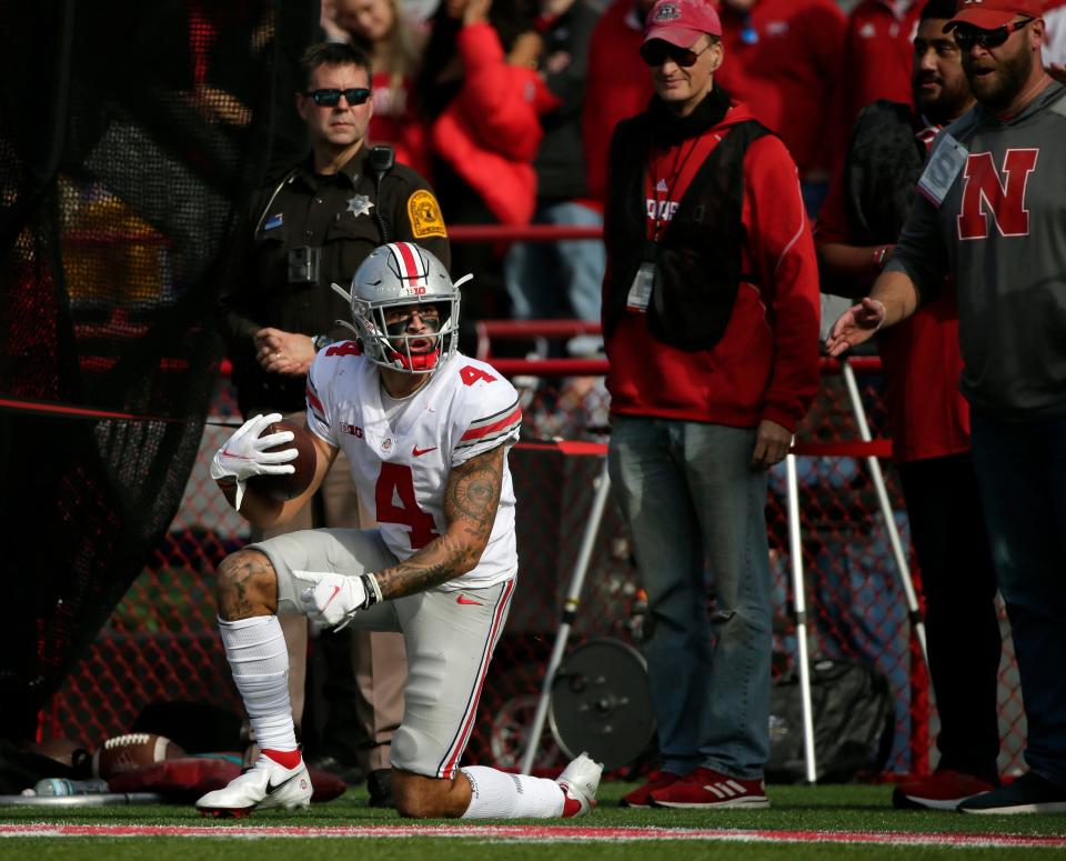 Ohio State Buckeyes wide receiver Julian Fleming (4) looks for a call after catching a pass during Saturday's NCAA Division I football game against the Nebraska Cornhuskers at Memorial Stadium in Lincoln, Neb., on November 6, 2021. Fleming was ruled out of bounds on the play.