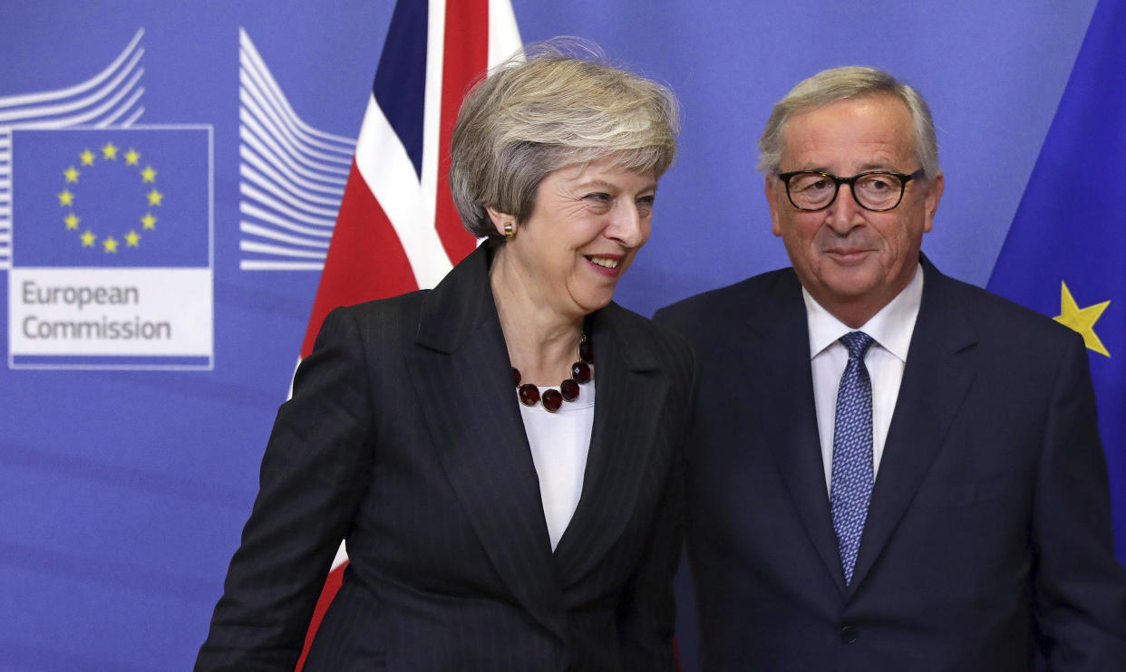 European Commission President Jean-Claude Juncker and British Prime Minister Theresa May at the EU headquarters in Brussels. (AP Photo/Olivier Matthys)