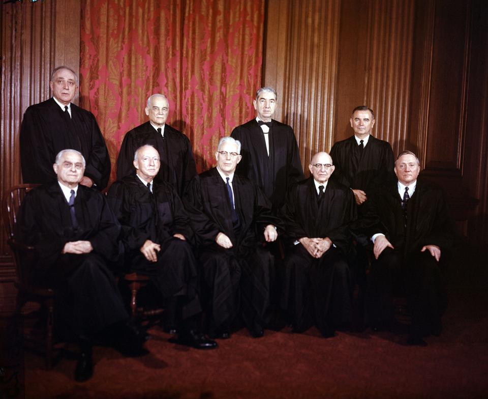 Justices of the Supreme Court of the United States of America are shown in their judicial robes in Washington, D.C., on Jan. 29, 1957.  Seated from left are, Felix Frankfurter; Hugo Black; Earl Warren, chief justice; Stanley Reed; and William O. Douglas.  Standing from left are, John M. Harlan; Harold Burton; Tom Clark; and William J. Brennan.
