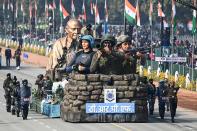 Police personnel march along a float representing the Central Reserve Police Force (CRPF) during the Republic Day parade in New Delhi on January 26, 2021. (Photo by Jewel SAMAD / AFP) (Photo by JEWEL SAMAD/AFP via Getty Images)