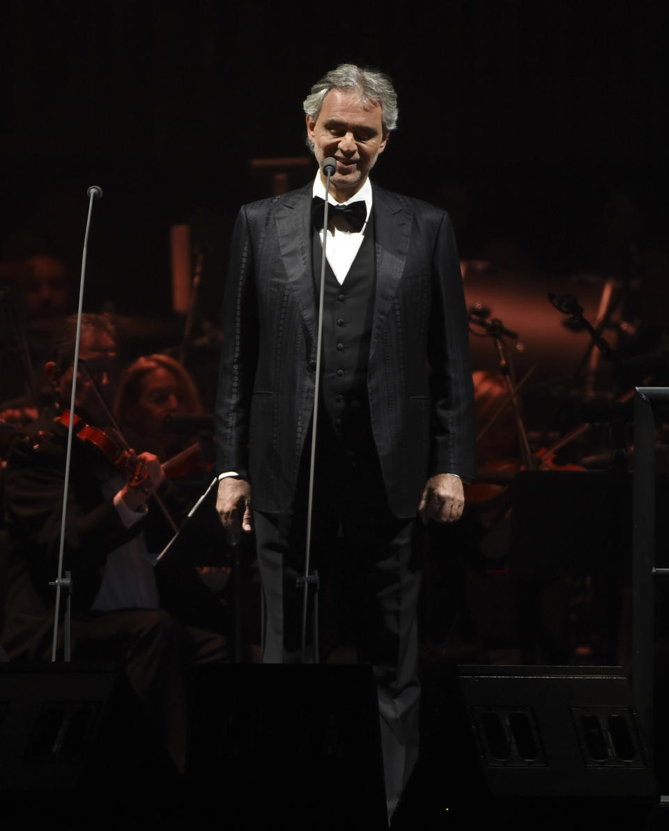 FILE - This Dec. 15, 2016 file photo shows tenor Andrea Bocelli performing with The Philharmonic of New York at Madison Square Garden in New York. Bocelli will give a solo livestreamed performance on Easter Sunday from the main historic cathedral in Milan, Italy. (Photo by Evan Agostini, File)