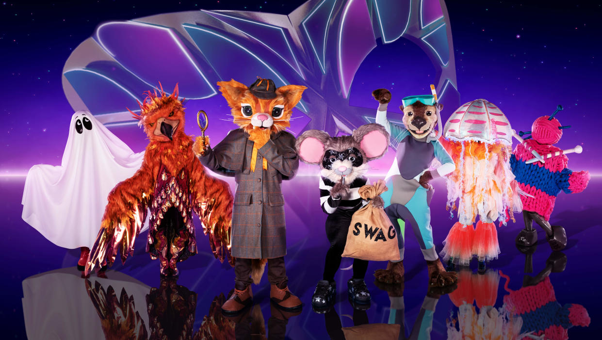  The Masked Singer UK season 4 contestants standing in a line . 
