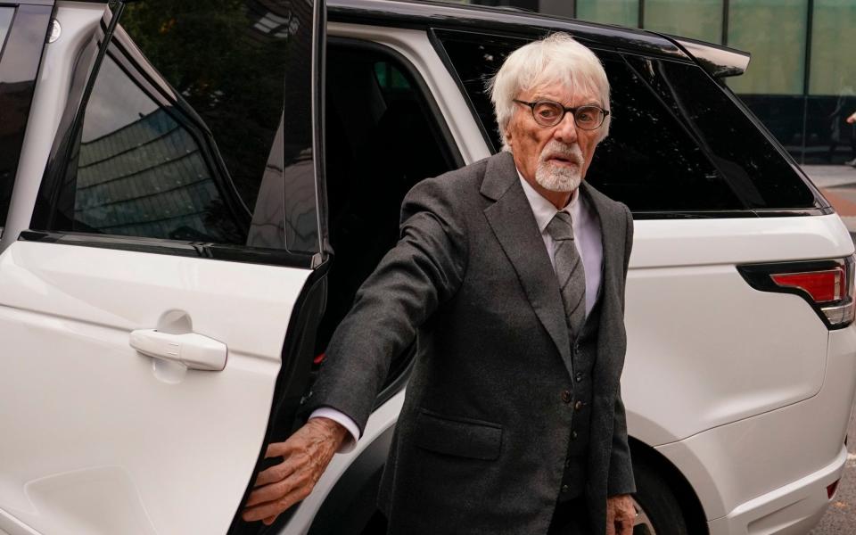 Ecclestone arrived at court in the back of his white Range Rover, with a personalised number plate, before his driver opened the door for him - Alberto Pezzali 
