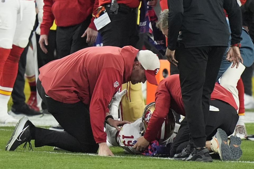 San Francisco 49ers wide receiver Deebo Samuel (19) is helped after an injury against the Kansas City Chiefs during the second half of the NFL Super Bowl 58 football game Sunday, Feb. 11, 2024, in Las Vegas. (AP Photo/Frank Franklin II)