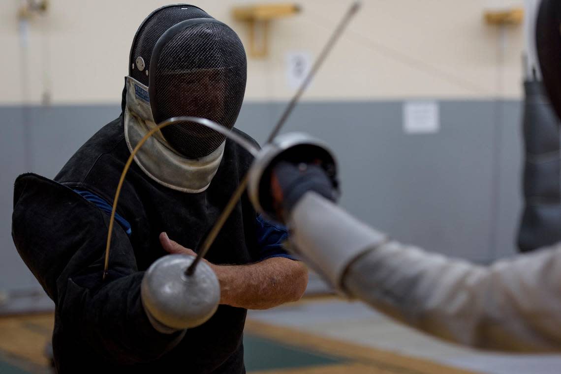 UNC-CH Fencing Head Coach Ron Miller gives a lesson at the Apex Fencing Academy in Apex, NC on June 27, 2019. Miller will be retiring after 52 years of coaching the UNC fencing team but will still stay active in the sport.