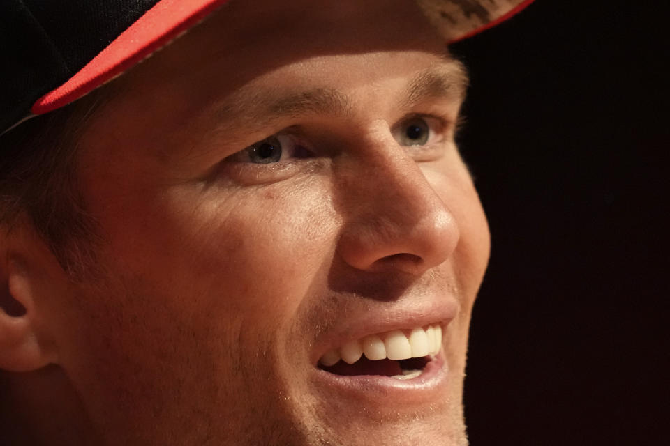 Tampa Bay Buccaneers quarterback Tom Brady attends a news conference after a practice session in Munich, Germany, Friday, Nov. 11, 2022. The Tampa Bay Buccaneers are set to play the Seattle Seahawks in an NFL game at the Allianz Arena in Munich on Sunday. (AP Photo/Matthias Schrader)