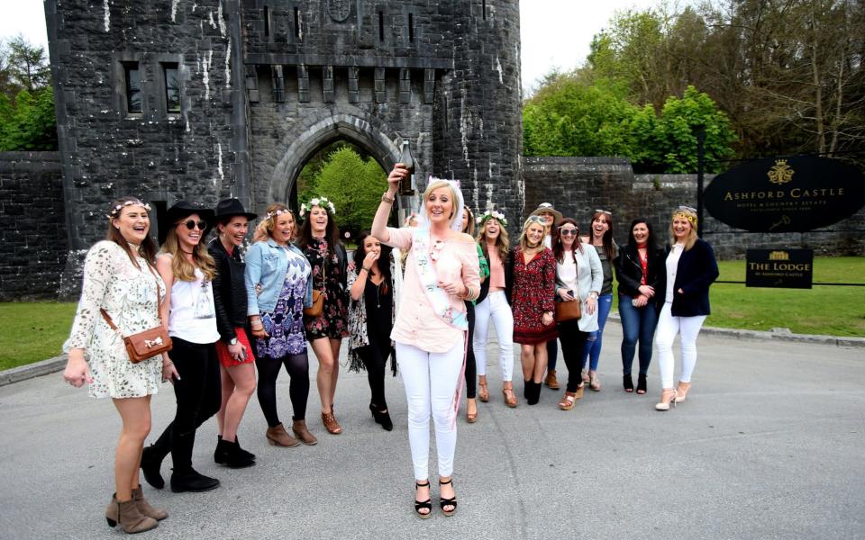 Bride to be Aiofe Power (centre ) stops with her hen party outside Ashford Castle in Co Mayo, where Golf star Rory McIlroy and fiancee Erica Stoll married on Saturday - Credit: PA