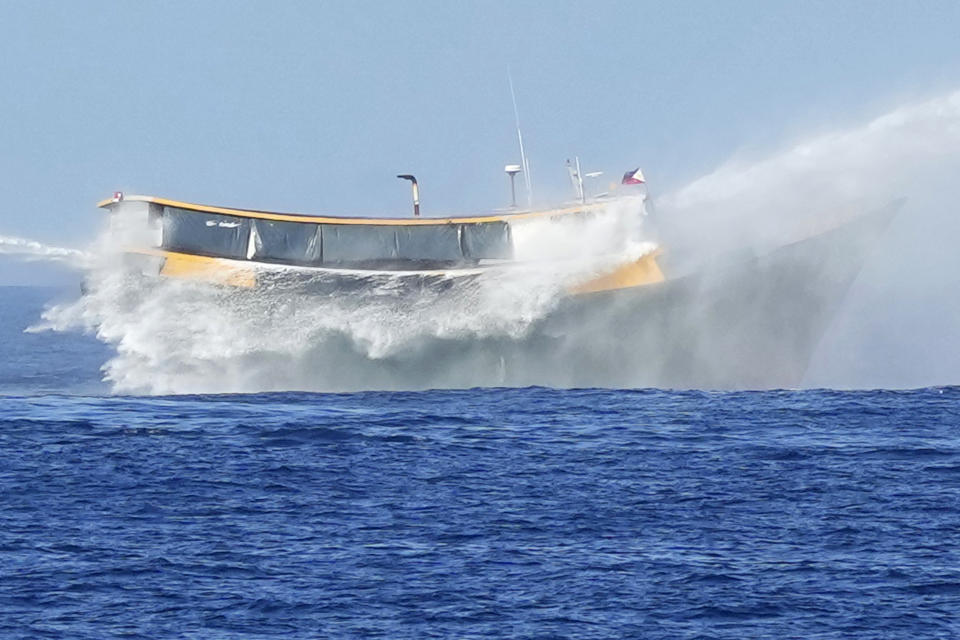 Philippine resupply vessel Unaizah May 4 is hit by two Chinese coast guard water canons as they tried to enter the Second Thomas Shoal, locally known as Ayungin Shoal, in the disputed South China Sea Tuesday, March 5, 2024. Chinese and Philippine coast guard vessels collided in the disputed South China Sea and four Filipino crew members were injured in high-seas confrontations Tuesday as Southeast Asian leaders gathered for a summit that was expected to touch on Beijing's aggression at sea. (AP Photo/Aaron Favila)