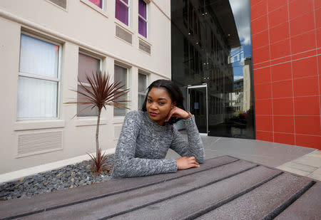 Jetilde Carlos, a 22-year old final year finance student, sits outside the Varsity College, owned by Johannesburg-listed ADvTECH Group, in Rondebosch, Cape Town, South Africa, September 22, 2017. Picture taken September 22, 2017. REUTERS/Mike Hutchings