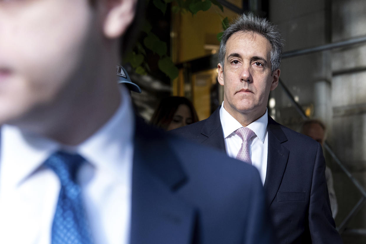 Michael Cohen leaves his apartment building on his way to Manhattan criminal court Monday. 