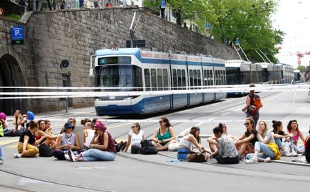 The traffic is blocked by the participants of a women's strike at the Central Square in Zurich