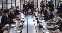 South Korean President Moon Jae-in, second from left, presides over a meeting with his security ministers, including National Security Advisor Chung Eui-yong, second from right, and National Intelligence Service Director Suh Hoon, third from right, one day before Chung and Suh make a one-day trip to North Korea at the presidential Blue House in Seoul, South Korea, Tuesday, Sept. 4, 2018. A South Korean presidential delegation on Wednesday, Sept. 5, plans to leave for North Korea for talks to arrange a summit planned later this month and rescue a faltering nuclear diplomacy between Washington and Pyongyang. (Hwang Gwang-mo/Yonhap via AP)