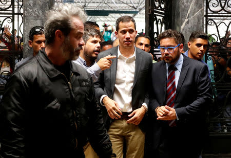 Venezuelan opposition leader Juan Guaido, who many nations have recognized as the country's rightful interim ruler, leaves after the meeting with public employees in Caracas, Venezuela March 5, 2019. REUTERS/Carlos Garcia Rawlins