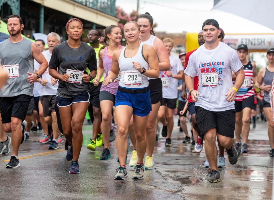 Runners participate in last year's Firecracker 5K in downtown Pensacola. The run benefits Ronald McDonald House Charities of Northwest Florida.