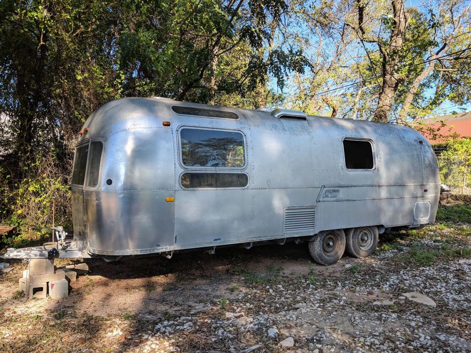 The exterior of the 1971 Airstream before it was converted.