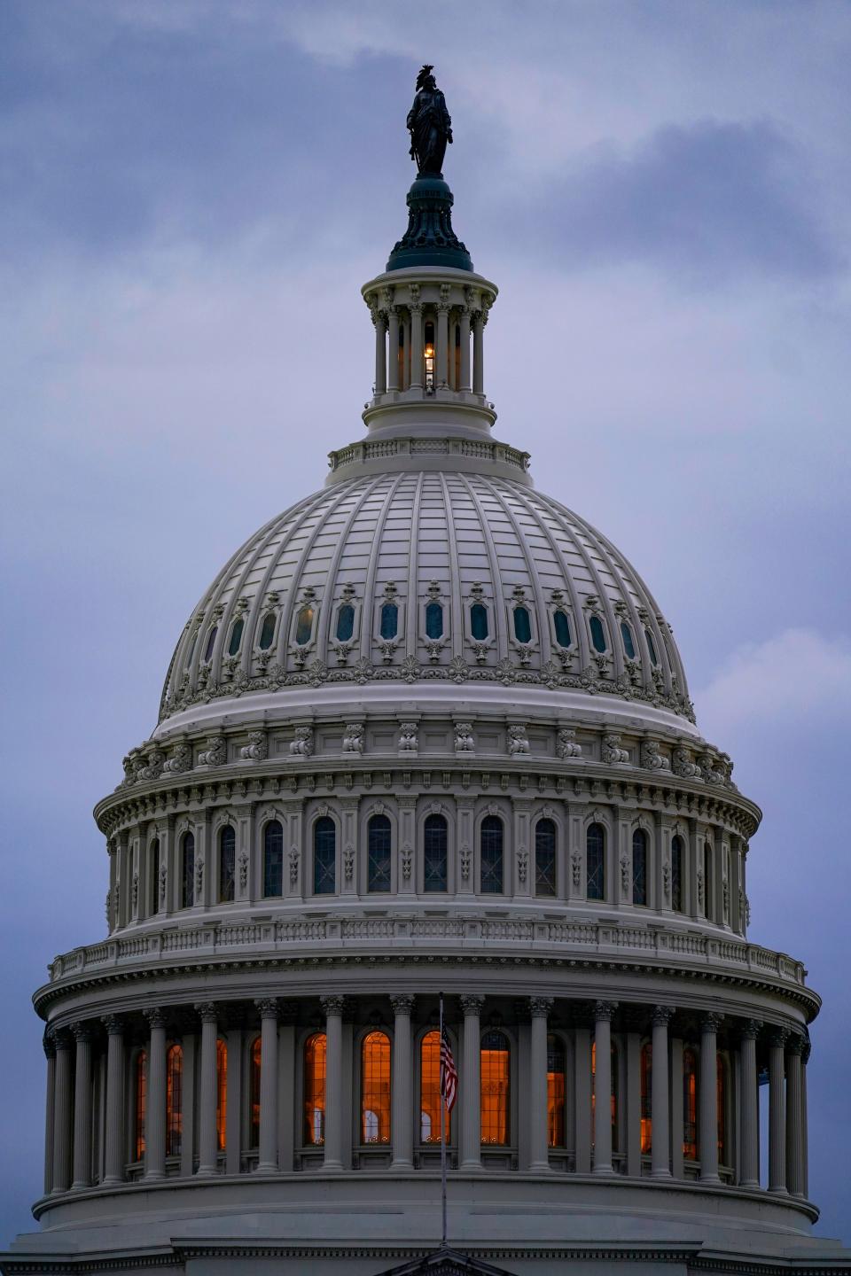 The light in the cupola of the Capitol Dome is illuminated, indicating that work continues in Congress, in Washington, Wednesday, Oct. 6, 2021.